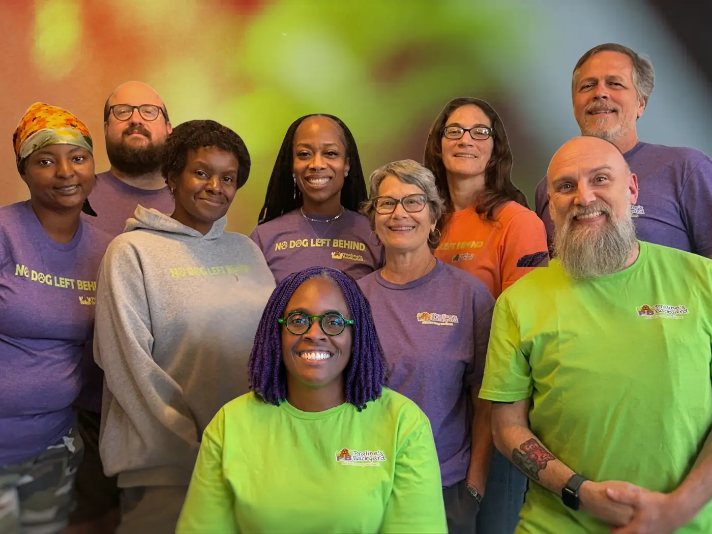The Praline's Backyard care team in their purple, green and orange team shirts